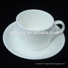 white ceramic cafe cup and saucer